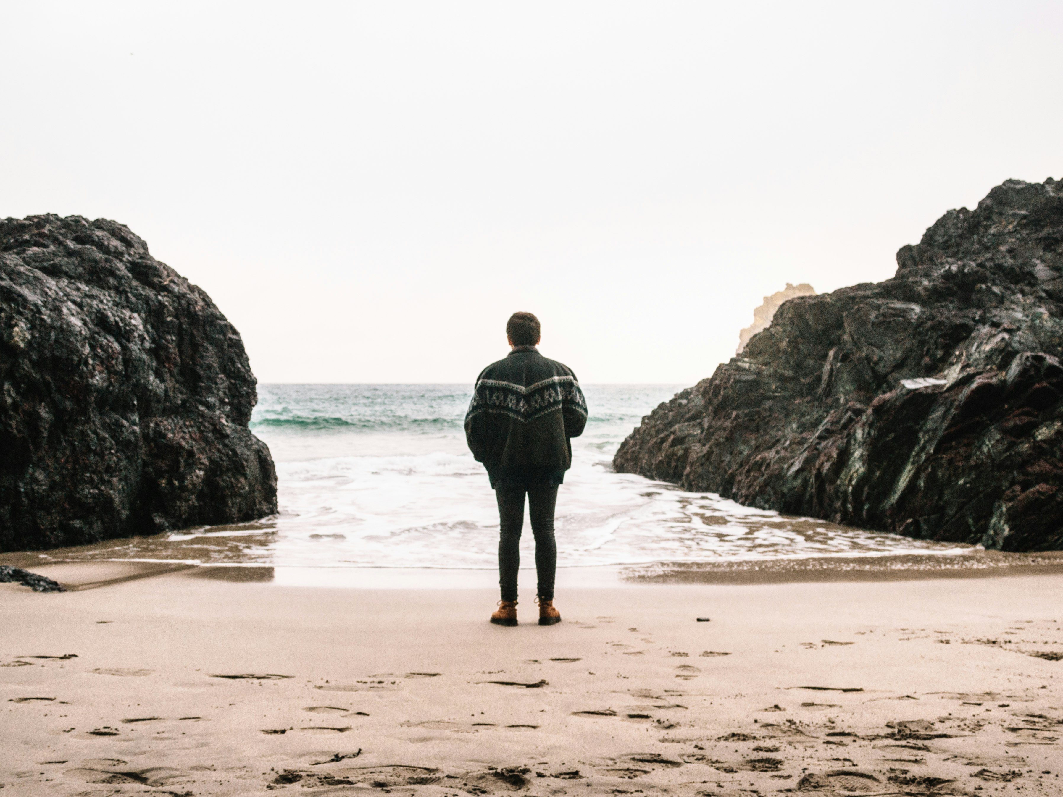 man near rock formation